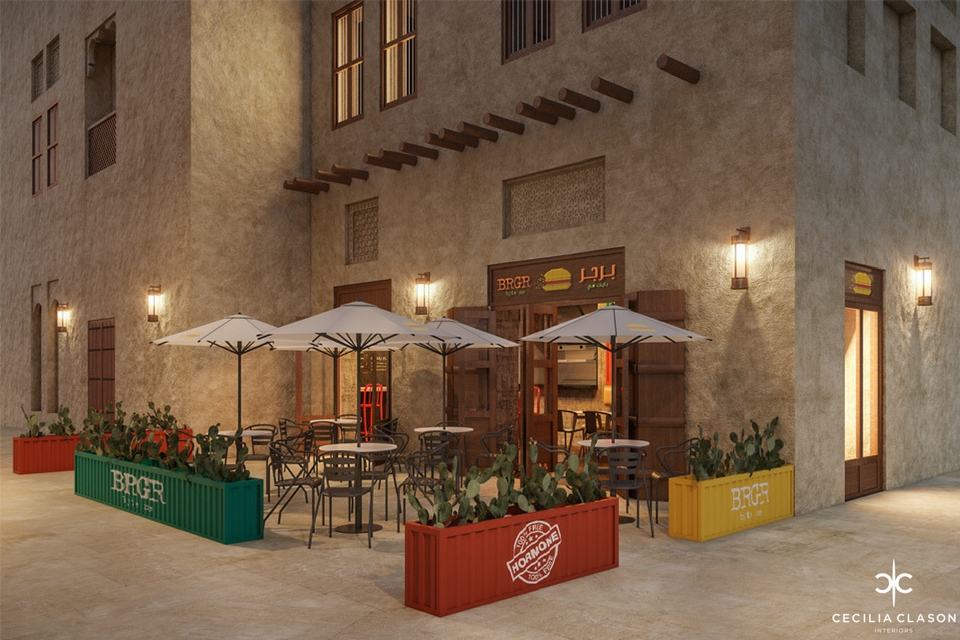 Restaurant Patio Design - Colourful industrial planter boxes surround the seating area which is shaded by white umbrellas
