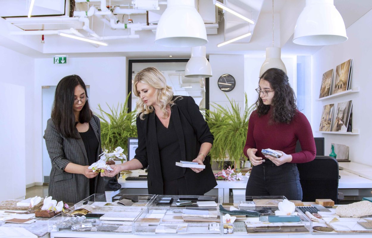 Cecilia Clason working with her interior decorating team