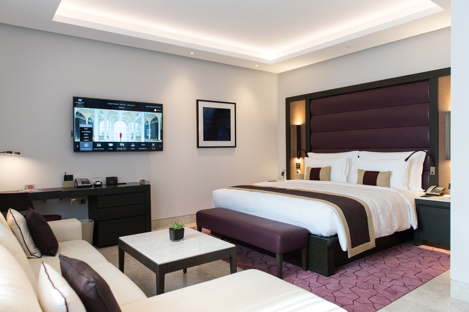 Hotel Bedroom Interior Design - Dark velvet theme with modern ceiling design & lighting, and a padded headboard