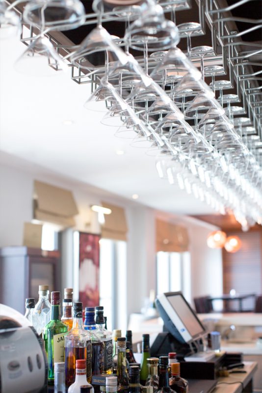 Bar Interior Design - Modern ceiling glass rack over bar