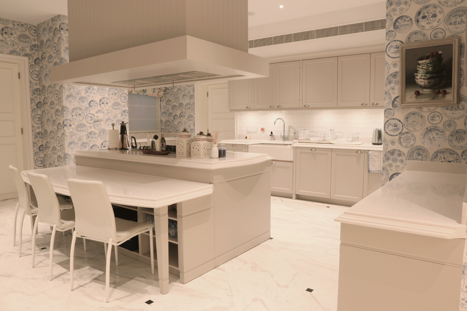 Apartment Kitchen Design - Blue & white China porcelain style walls, cabinets with white granite tops & modern cooking island