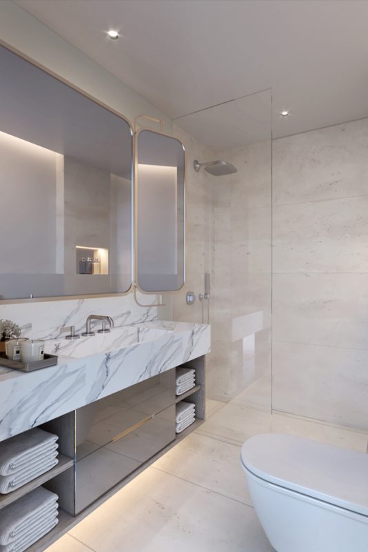 Interior Bathroom Design - Modern bathroom with rounded corner mirrors, marble walls & counter tops with silver storage unit