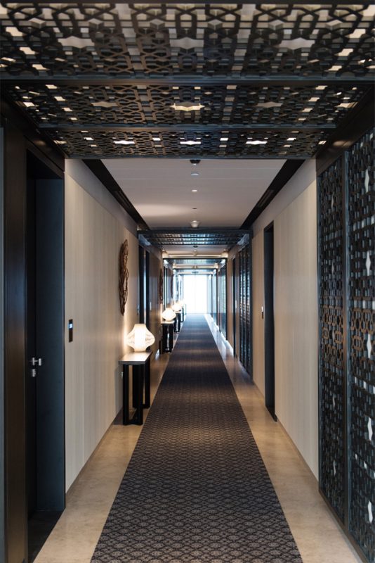 Hotel Passage Design - Passage entrance with Molded GRP-paneled wall & ceiling feature & runner on marble floor