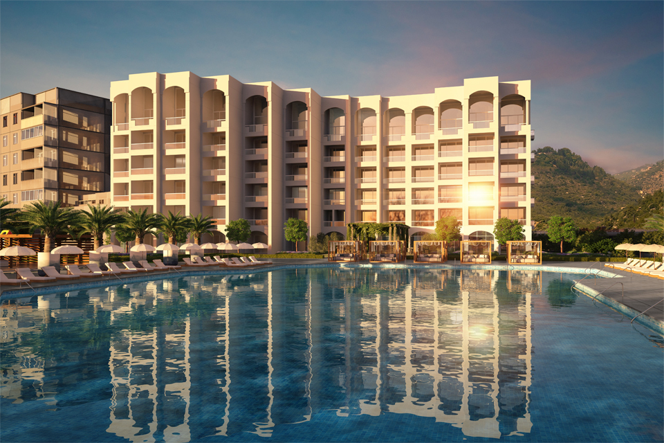 Hotel Design by Cecilia Clason Interiors - Hotel building overlooking large pool with sunbeds, umbrellas & palm trees
