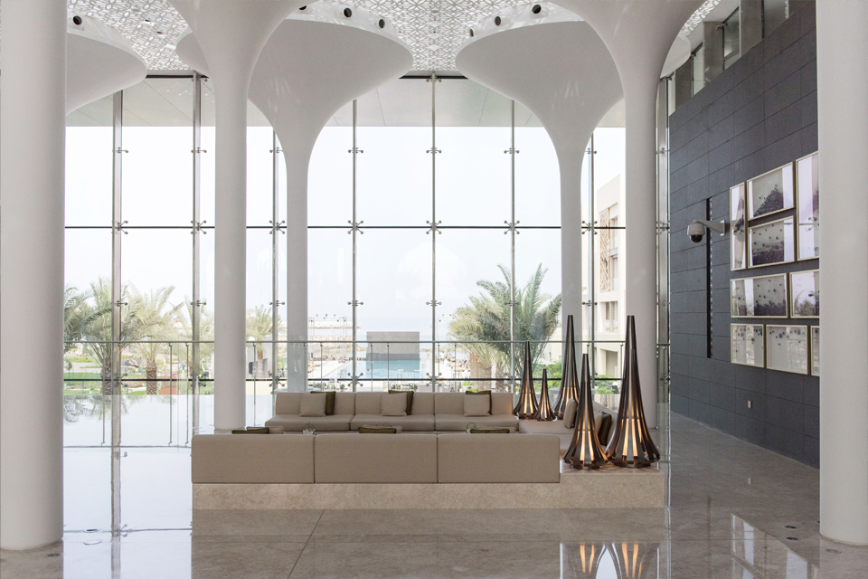 Hotel Interior Design - Molded GRP-paneled ceiling, illuminated columns, light marble floor & large glass windowpanes